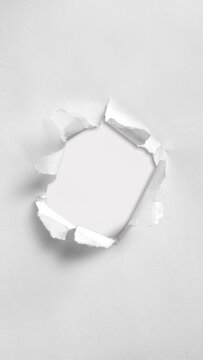 the hole is centered, creating a balanced and graphic composition that resembles a minimalist paper collage or conceptual still-life photograph.