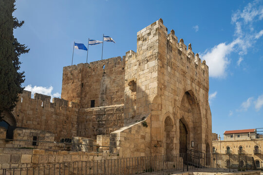 Jerusalem, Israel, April 4, 2026. Tower of David citadel with israeli flags flying under a blue sky.