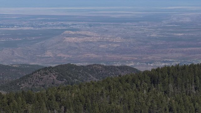 Aerial Lincoln National Forest and Alamogordo valley with scenic layers in Cloudcroft New Mexico