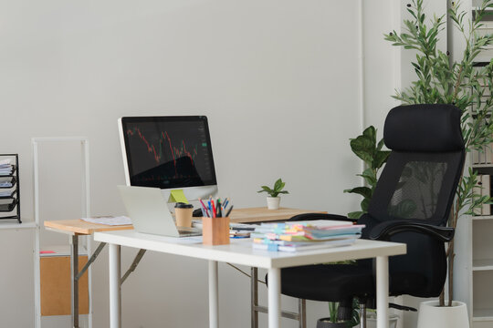 Modern workspace essentials: a thoughtfully designed office desk and chair set in a clean, contemporary office, suggesting a blend of productivity and comfort.