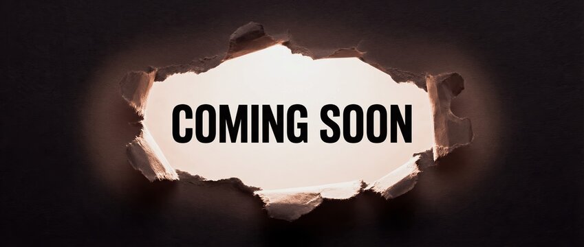 A dark background with a torn hole revealing a bright light and the words COMING SOON in bold black letters