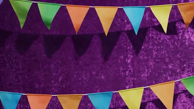 Vibrant purple backdrop with colorful triangular bunting flags, festive Cinco de Mayo party background decoration, lively celebration banner setup for events