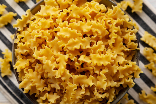 Dry Mafalda Corta Pasta in a Bowl, top view.