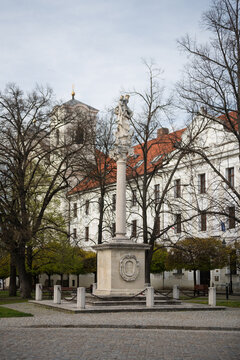 The Baroque Marian Plague Column in the main square of Skalica, Slovakia, with the Jesuit Church and College in the background
