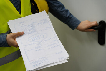 Warehouse worker reviewing documents or international waybill 