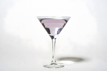 Obraz premium A transparent glass of cold water and a glass of champagne with wine and ice reflections stand isolated on a white background near a party bar