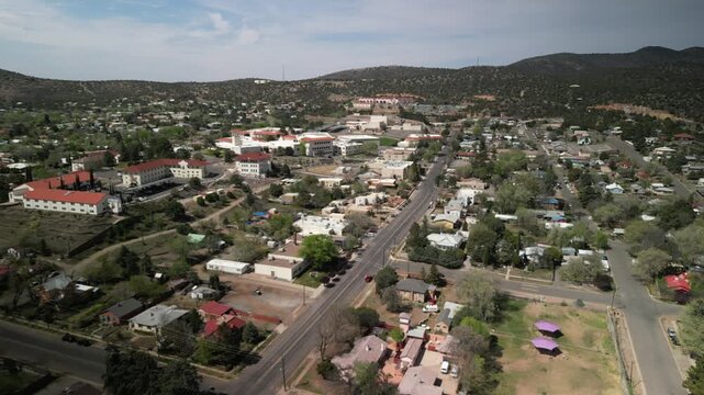 Aerial above Silver City New Mexico historic mining town in springtime on sunny day