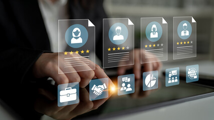 Obraz premium A business professional interacts with digital profiles and ratings on a touchscreen, exemplifying modern networking and collaboration in a dynamic workspace, driving professional growth. Ledger