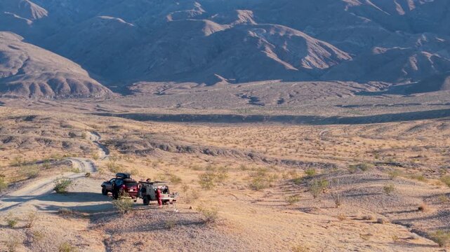 Aerial views show a teardrop camper trailer and SUV camping along the Thimble trail in the Anza Borrego Desert State Park and BLM land.