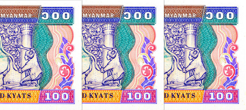 100 Kyats Myanmar with images of working people and traditional architecture. Old Paper Money of Myanmar