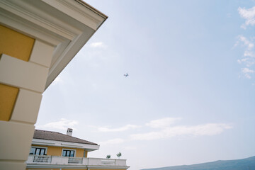 Open Sky Over Ocean With Architectural Details And Flying Jet © VolodymyrNadtochii