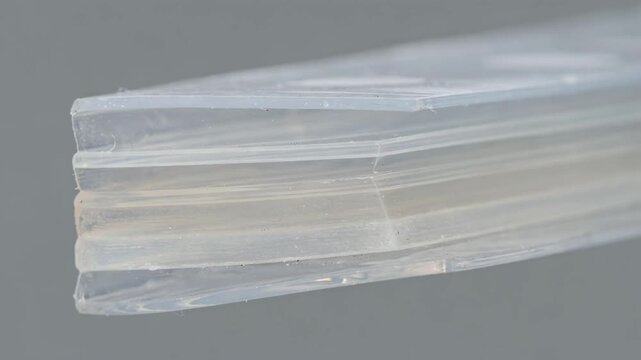 Medium shot of coextruded unlaminated barrier film showcasing multiple polymer layers with enhanced protection against moisture and gas transmission.
