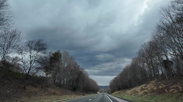 Driving on Freeway in North Carolina Under Gray Clouds