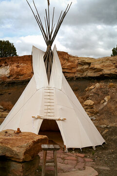 Traditional Teepee Structure in Desert Landscape Cultural Setting
