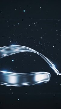 Vertical video: Metal ribbon entering right, causing twist into spinning tech ring as logo reveal