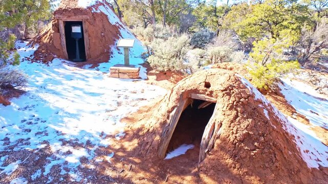 Traditional Navajo hogan dwelling is displayed within cultural landscape at Navajo National Monument in Arizona