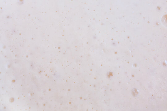 Smooth yeast dough texture background, fermentation bubbles, baking concept for bread and Easter pastry