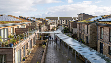 Fototapeta premium Contemporary Townhouse Courtyard in Irvine Scotland With Solar Equipped Roof Terraces and Sheltered Pedestrian Paths, Urban Housing, Sustainable Residential Architecture