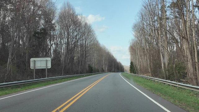Driving Through a Forested Area in North Carolina During Spring