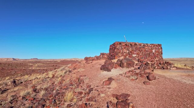 Historic Agate House built from petrified wood stands within desert landscape in Petrified Forest National Park Arizona