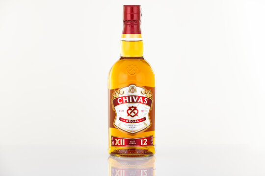 Chivas Regal 12 years blended Scotch whisky bottle photographed in studio on white background. Premium whisky packaging isolated in clean catalog style for illustrative editorial use.
