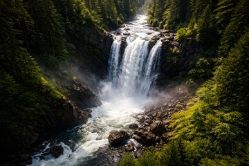 Fototapeta premium A serene waterfall cascading down a rocky slope surrounded by lush greenery and dense forest