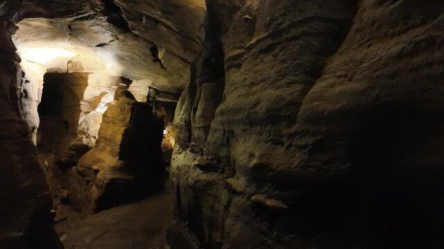 Underground Cavern With Rock Formations and Warm Lighting