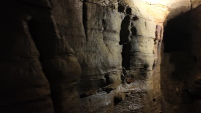 Pan of Underground Cavern Cave Exploring Natural Rock Formations