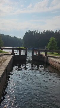opening the gates of the old manual lock on the Augustow Canal in Belarus