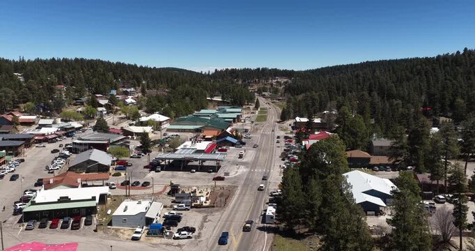 Aerial above Cloudcroft New Mexico mountain town on sunny spring day