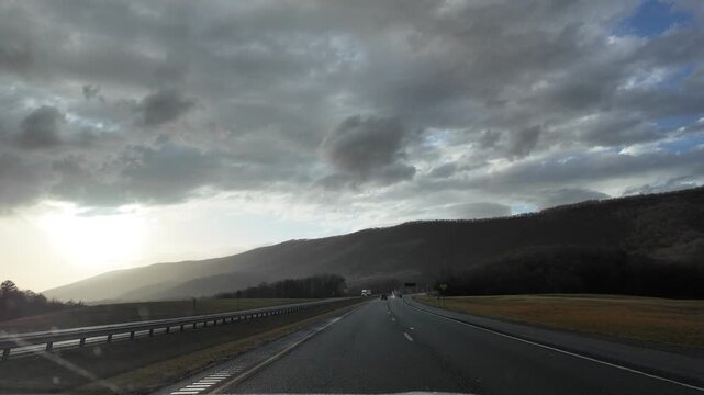 Dawn Sun Breaks Through Clouds in Appalachian Mountains