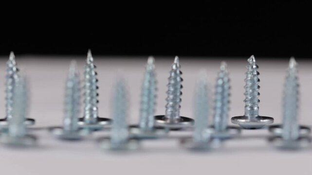 Metal screws for fastening equipment. Soft focus. Close-up. 