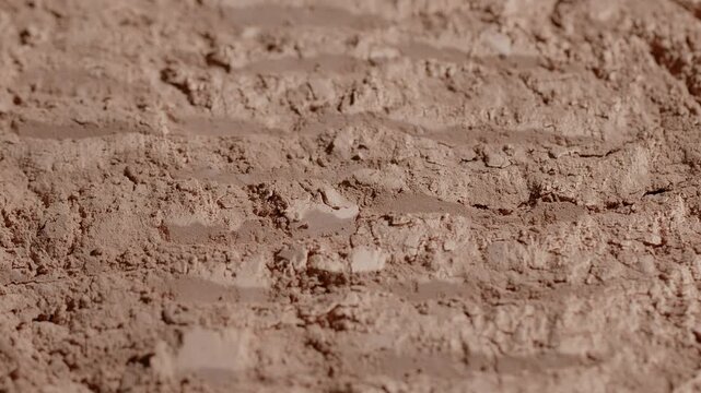 Macro close up of beige face powder texture lines