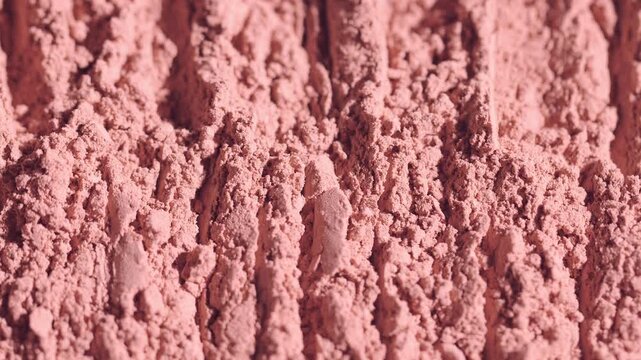 Macro close up of beige face blush texture lines