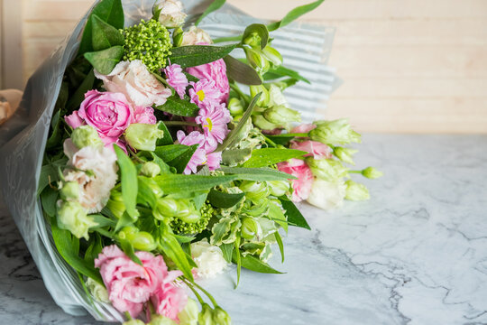 Celebrate special occasions with a colorful summer bouquet featuring fresh roses, eustoma blooms, creating an elegant and fragrant floral arrangement. love concept. copy space