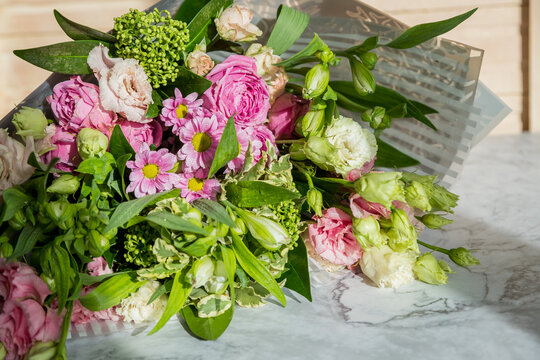 Celebrate special occasions with a colorful summer bouquet featuring fresh roses, eustoma blooms, creating an elegant and fragrant floral arrangement. love concept. copy space