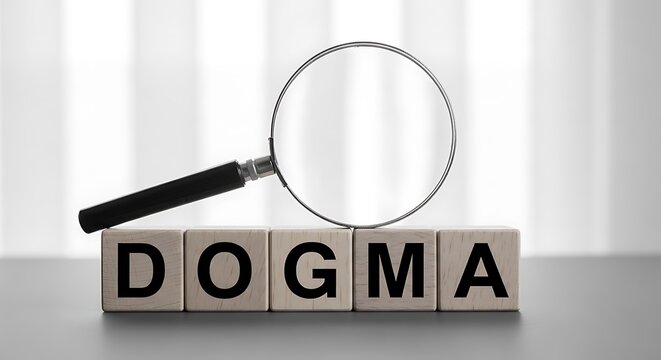 Wooden blocks spelling the word dogma under a magnifying glass