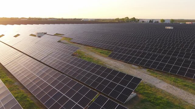 Solar Energy Farm Aerial Panoramic View at Sunset Clean Power Generation