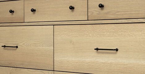 Neutral stain color on wooden white oak cabinetry with rift, plain and quarter sawn grain patterns 