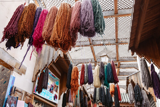 Dyed wool hanging to dry in artisan dye workshops in the medina of Fez.