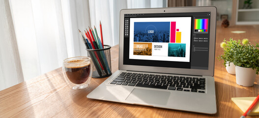 Graphic designer software for modern design of web page and commercial ads showing on the computer...