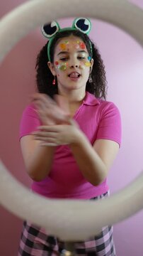 Bright Pink Studio With Lively Dance. Energetic Teenager Wiggles And Lip Syncs In Colorful Setting