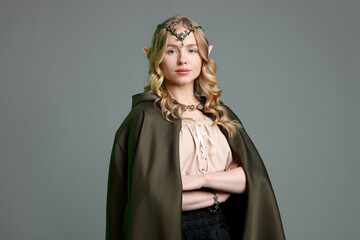 Obraz premium Portrait of beautiful elf girl on grey background