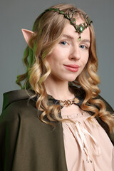 Obraz premium Portrait of beautiful elf girl on grey background