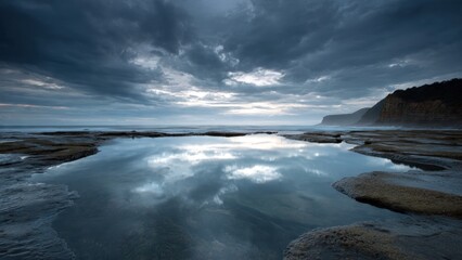 Fototapeta premium Dramatic Coastal Sky Reflected in Tide Pool