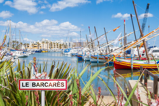 Fishing boats and marina in Le Barcar&egrave;s with added town sign illustration - France