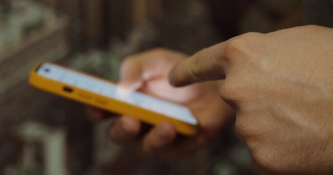 Hand Scrolling on Smartphone Close-Up &ndash; Mobile Browsing and Social Media Concept