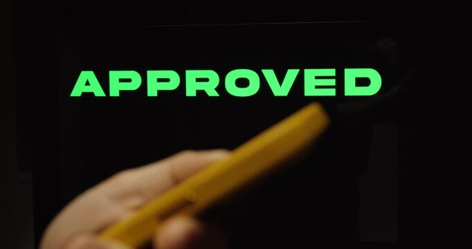 Hand Swiping Up on Smartphone with Approved Status &ndash; Success Confirmation Concept