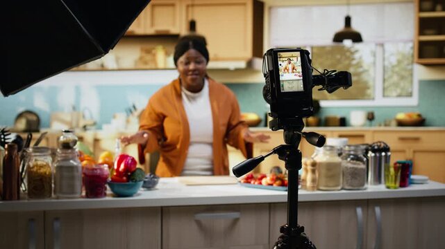 African american influencer, cooking video, recipe at home, behind the scenes, filming step by step cooking process and meal preparation. Creating content for social media platforms.