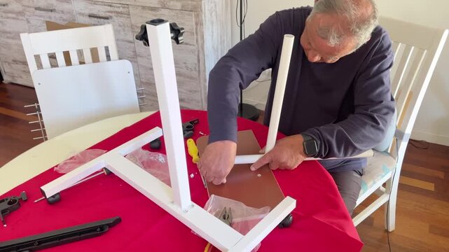 Step by Step Furniture Assembly Process by a Mature Man